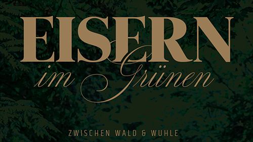 Eisen in eleganter Schrift auf grünem Hintergrund, mit dem Zusatz "zwischen Wald & Wuhle".