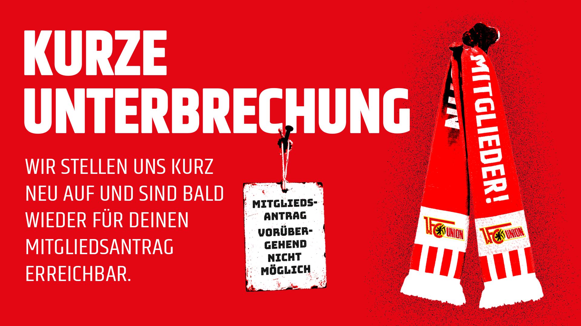 Kurze Unterbrechung für Mitgliederanträge mit roten Schals und einem Hinweisschild auf rotem Hintergrund.