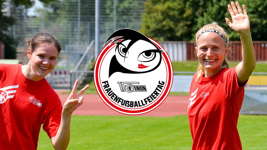 Two cheerful women in red T-shirts smile and wave on a soccer field, framed by a logo for Women's Football Day.