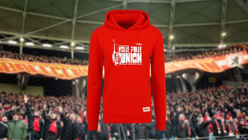 Red hoodie with the print "Vollie Pulle Union" in front of a cheering fans backdrop.