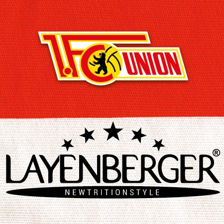 Logo des 1. FC Union Berlin oberhalb des Layenberger-Logos auf einem roten und weißen Hintergrund.